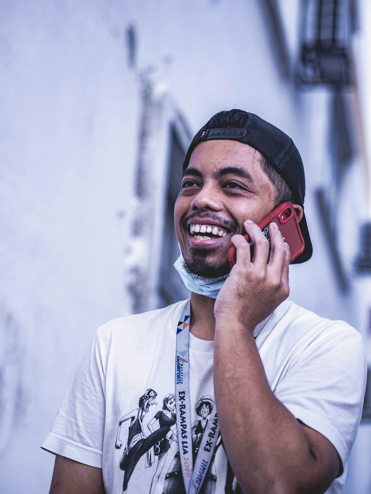 A smiling person checking their phone
